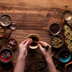 ayurvedic practitioner mixing herbs