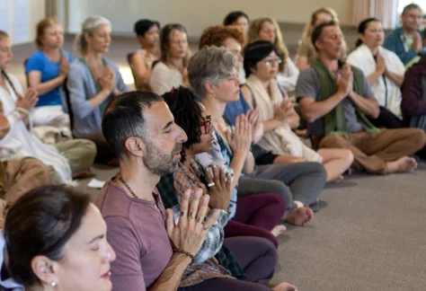 People sitting in a semicircle during Mount Madonna's New Year's Yoga Retreat