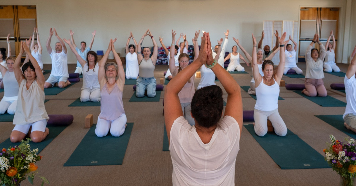 People gathered for a yoga class during the Mount Madonna Living Yoga Retreat in springtime.
