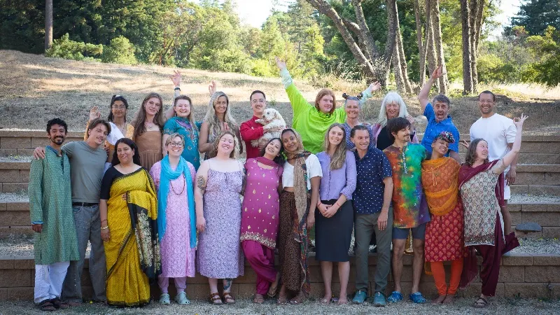 Happy group of graduates from Mount Madonna’s 200-hour Yoga Teacher Training outdoors on their final day