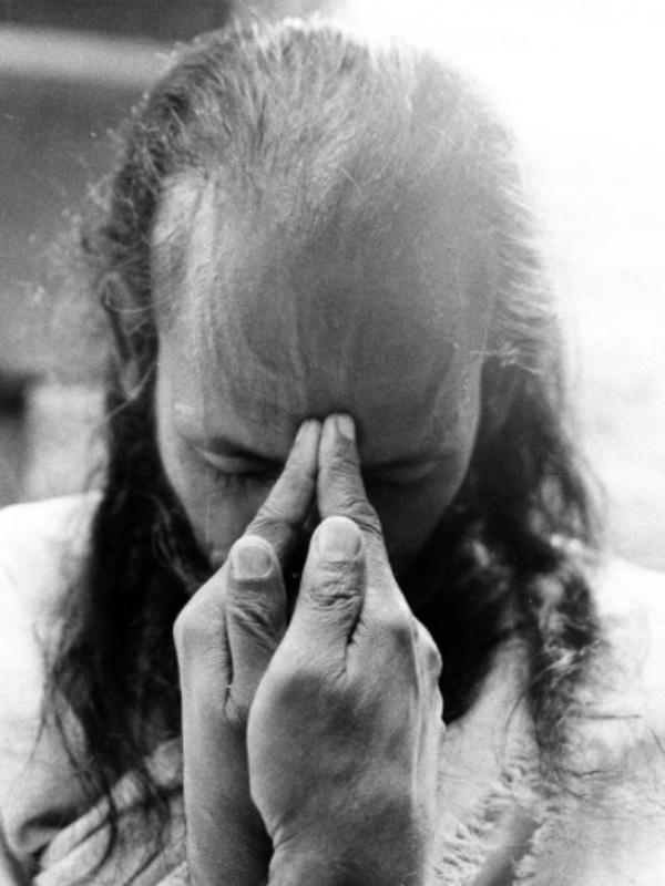 Babaji with his head bowed and hands posed