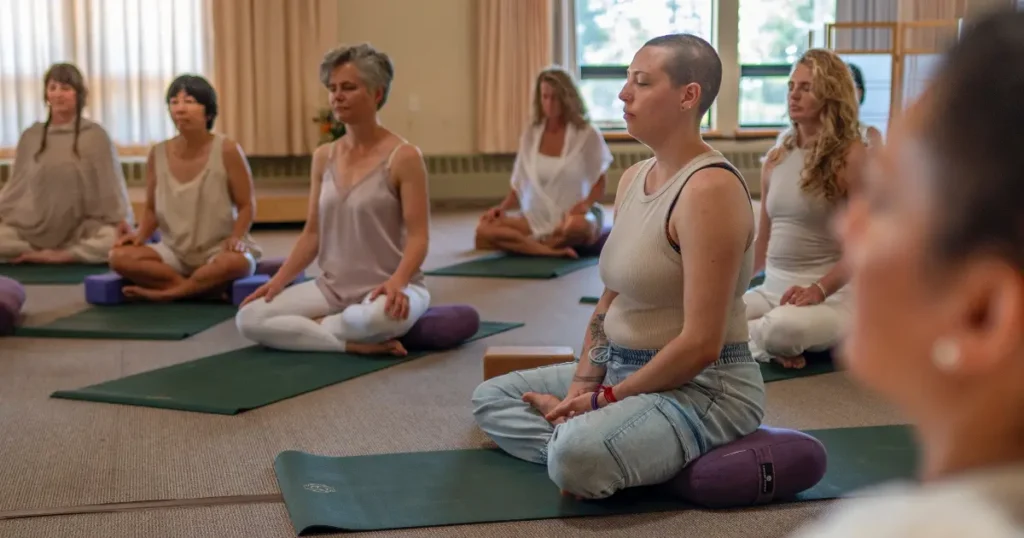 group of people seated in yin yoga class