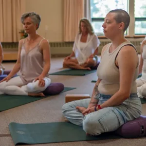 group of people seated in yin yoga class