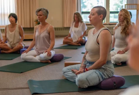 group of people seated in yin yoga class