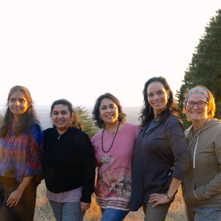 Group of five people gathered together for the Inner Flowering Retreat 2026