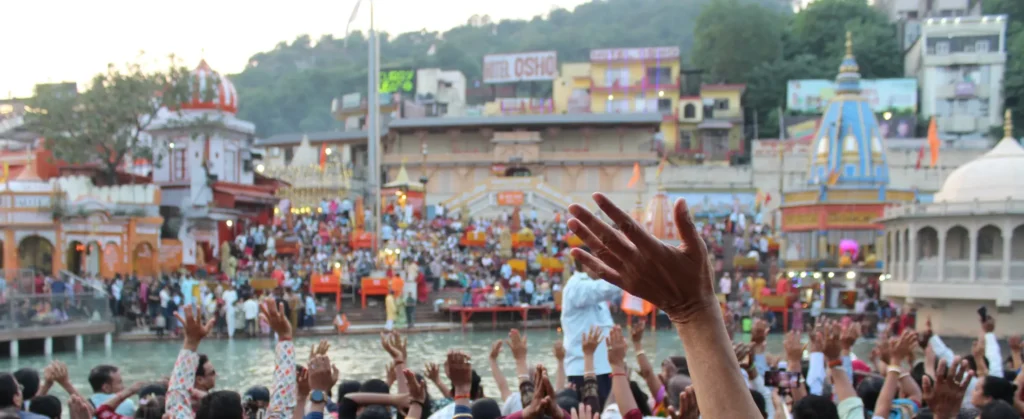 Hands up in the air for Ganga arati at Hari Ki Pauri in India