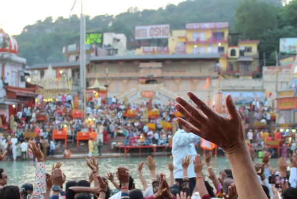 Hands up in the air for Ganga arati at Hari Ki Pauri in India