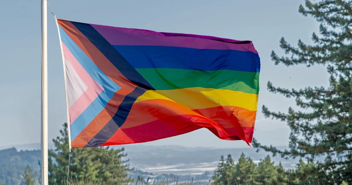 Pride flag and trees for Mount Madonna's participation in the Santa Cruz Pride Festival & Parade