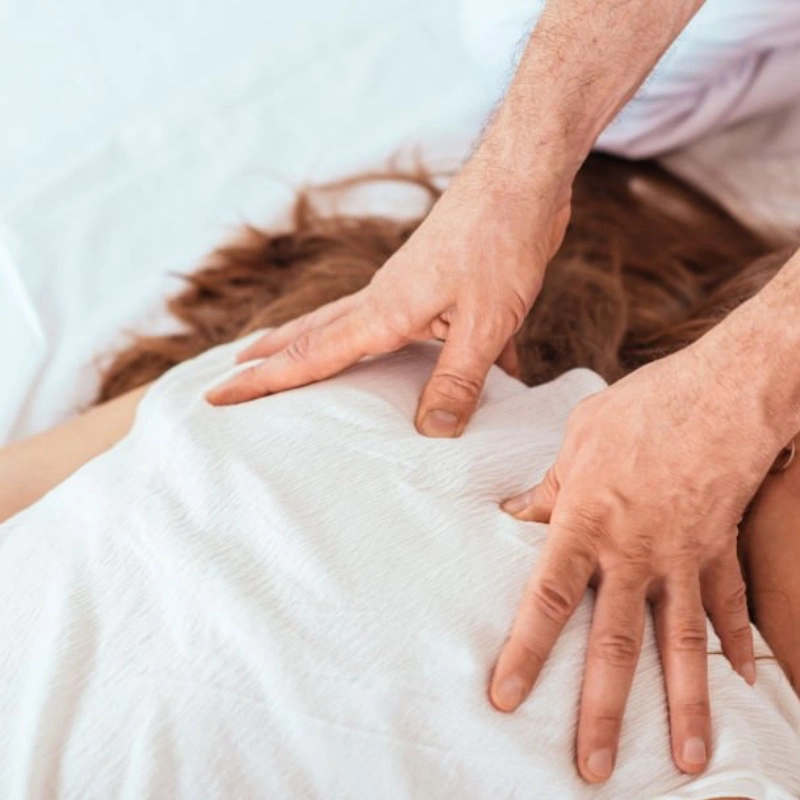 Person receiving Shiatsu massage at Kaya Kalpa Wellness Center, Mount Madonna
