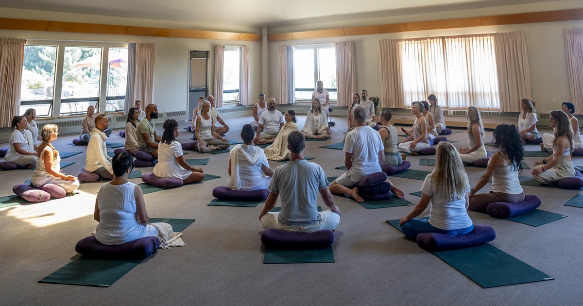 Group of people meditating together during the Fall Silent Meditation Retreat at Mount Madonna in Northern California