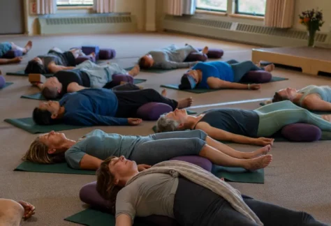 Group of people laying on ground during a restorative yoga class at Mount Madonna