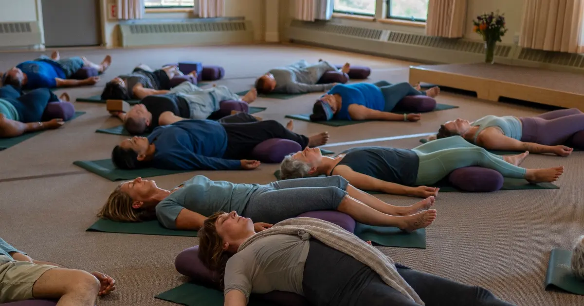 Group of people laying on ground during a restorative yoga class at Mount Madonna