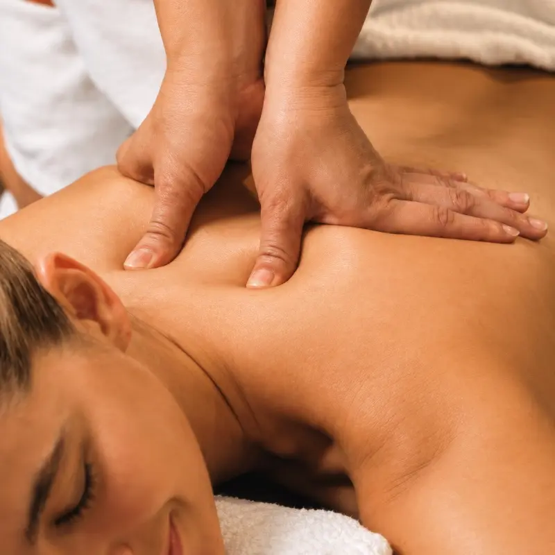 person receiving neuromuscular therapy massage at Kaya Kalpa Wellness Center