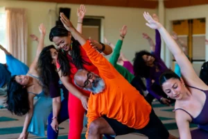 People attending a yoga class during the in-person module of the Hybrid YTT 200 Yoga Teacher Training at Mount Madonna