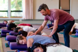 People in restorative yoga class