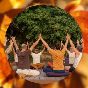 People sitting in circle with arms up for Thanksgiving at Mount Madonna 2026